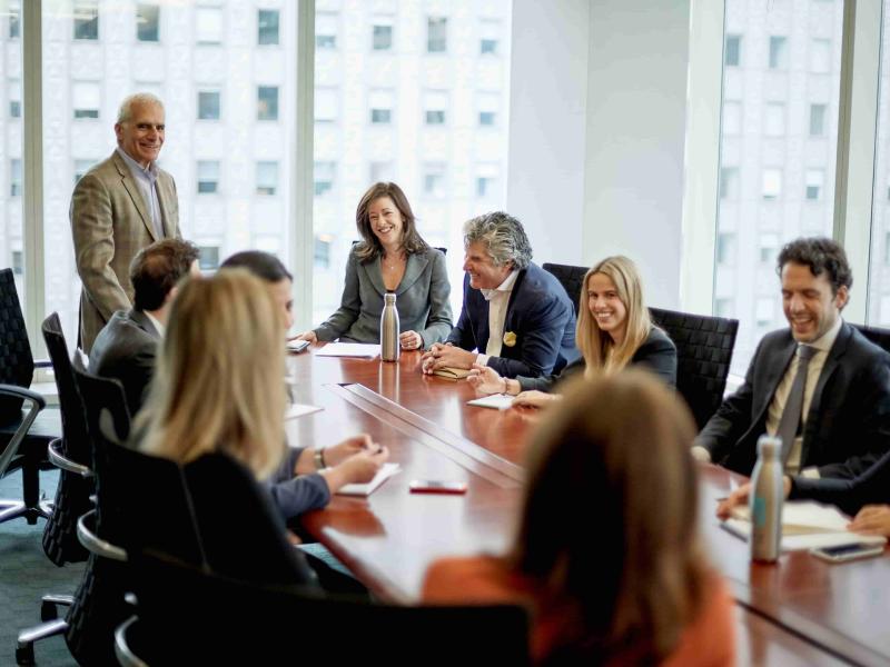 Business people gathered around a conference table
